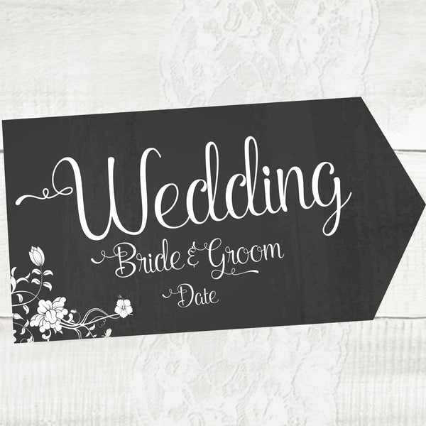 Wedding Pointer sign in Black and white chalkboard design with delicate white flowers, personalise with Bride and Grooms names and their wedding date. Comes in either left pointing, right pointing or be safe and go for double sided