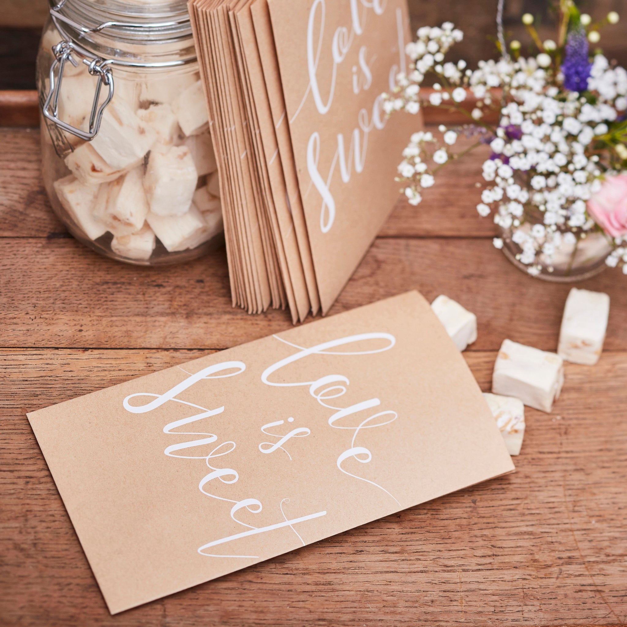 Kraft Treat Bags perfect for wedding favour sweet tables and for your guests to take some goodies away! Pack includes 20 paper party bags with Love is Sweet printed on the front.