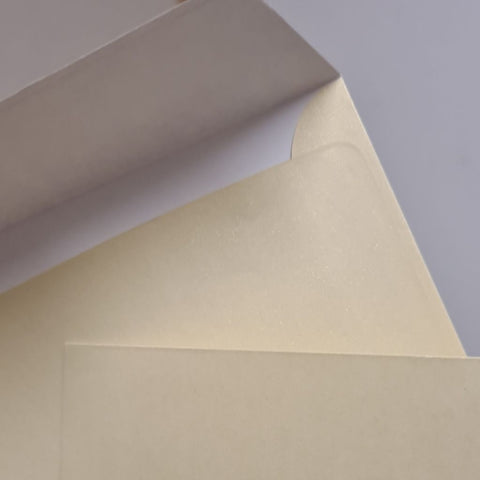 Champagne coloured pearlised envelopes, size 155x155mm would suit a square card 145-147mm square, being sold at cost