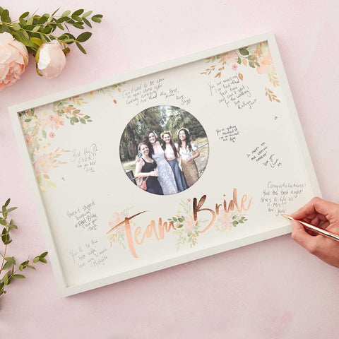 Alternative guestbook idea for your hen party or bridal shower, It has the words "Team Bride" gold foiled on it and plenty of room for your guests to write their messages.