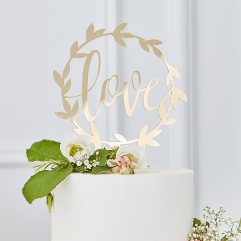 Gold Acrylic Cake Topper, circular wreath design in a rustic style. Wording reads Love in an elegant script font
