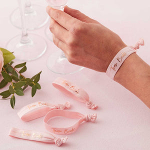 Pale Pink wristbands with Team Bride gold-foiled on each band, a nice little addition for the occasion.