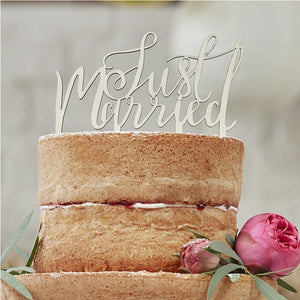 Wedding Cake Topper in rustic wood, wording reads Just Married in a beautiful script font style.